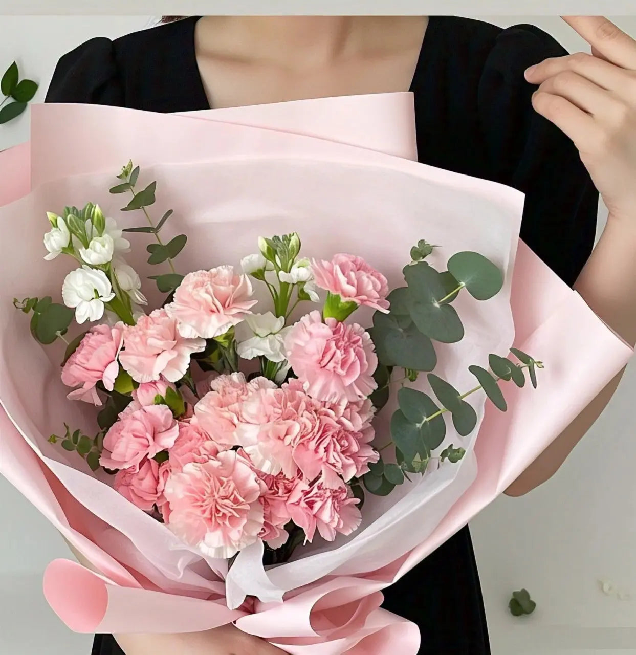 Vibrant bouquet featuring pink, shocking pink, and white carnations with eucalyptus leaves, available for flower delivery in Hong Kong
