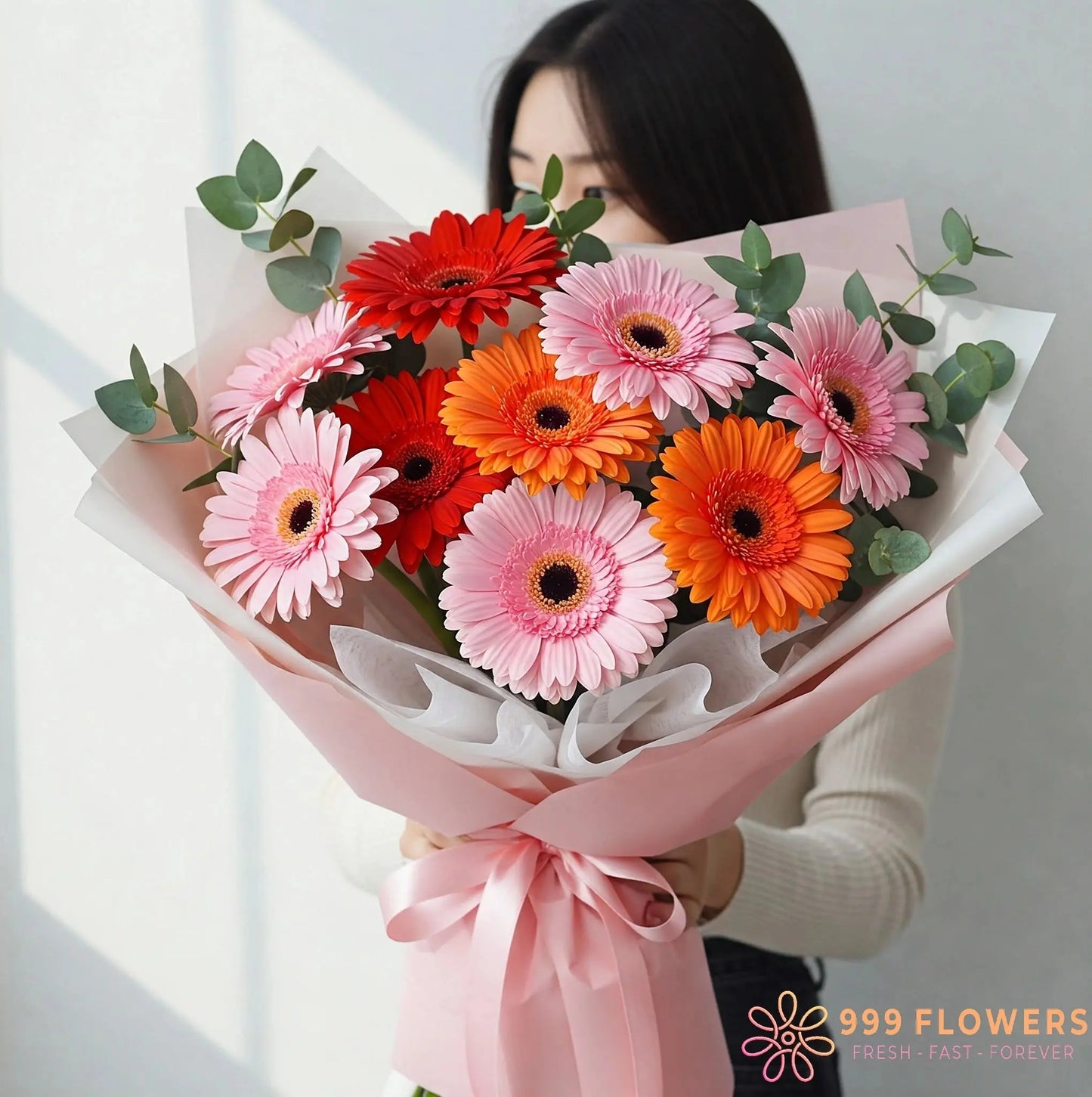 Celestial Radiance Bloom bouquet delivery Hong Kong: Light pink, orange, and red gerberas with eucalyptus and green fillers