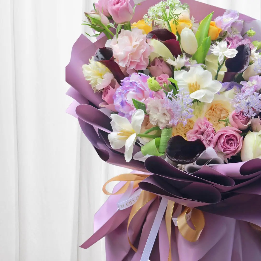 Luxurious bouquet with roses, peonies, lilies, and carnations in soft pink and lavender hues perfect for any celebration in Hong Kong.