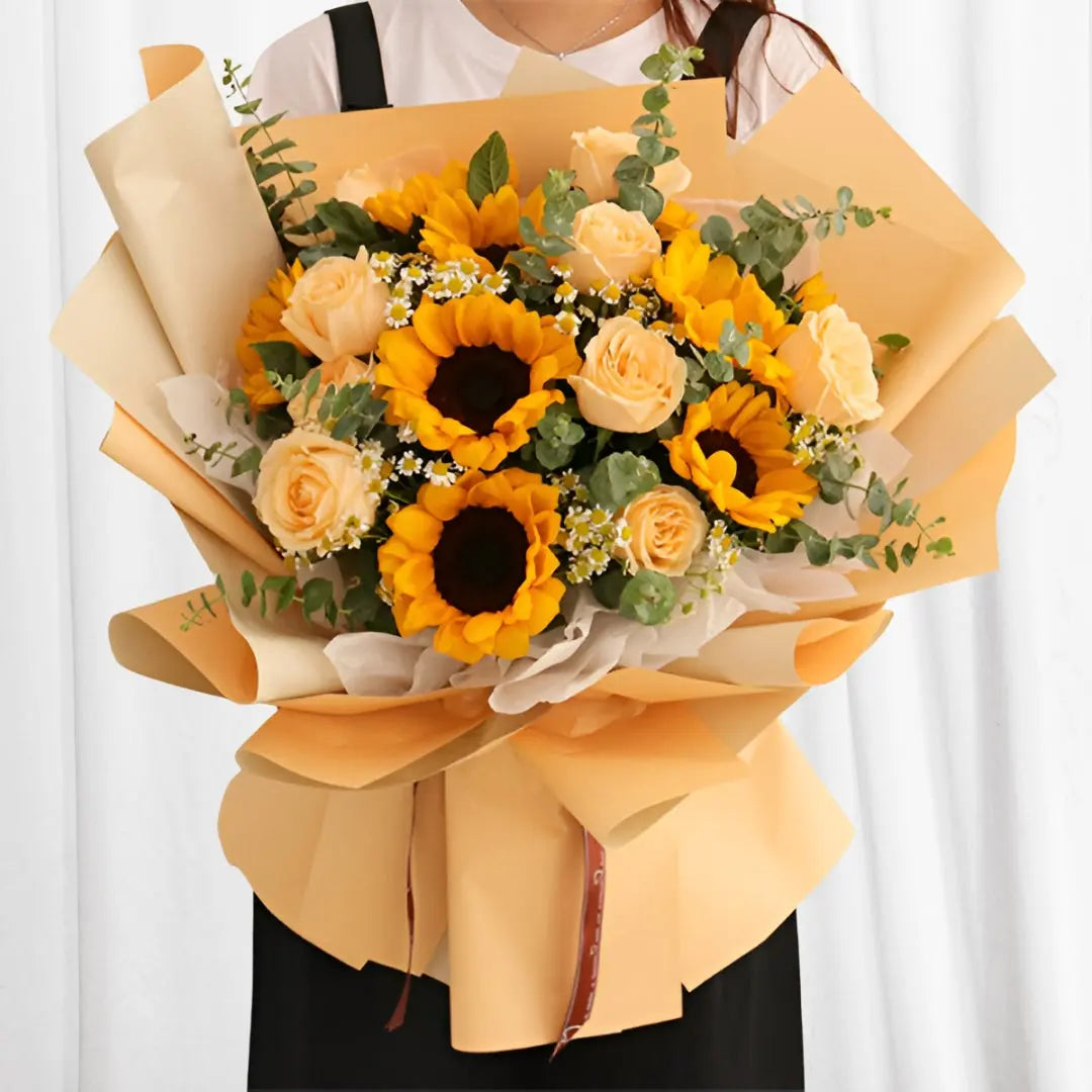 Sunny Peach Delight Bouquet with 5 sunflowers, 7 peach roses, eucalyptus, and baby’s breath