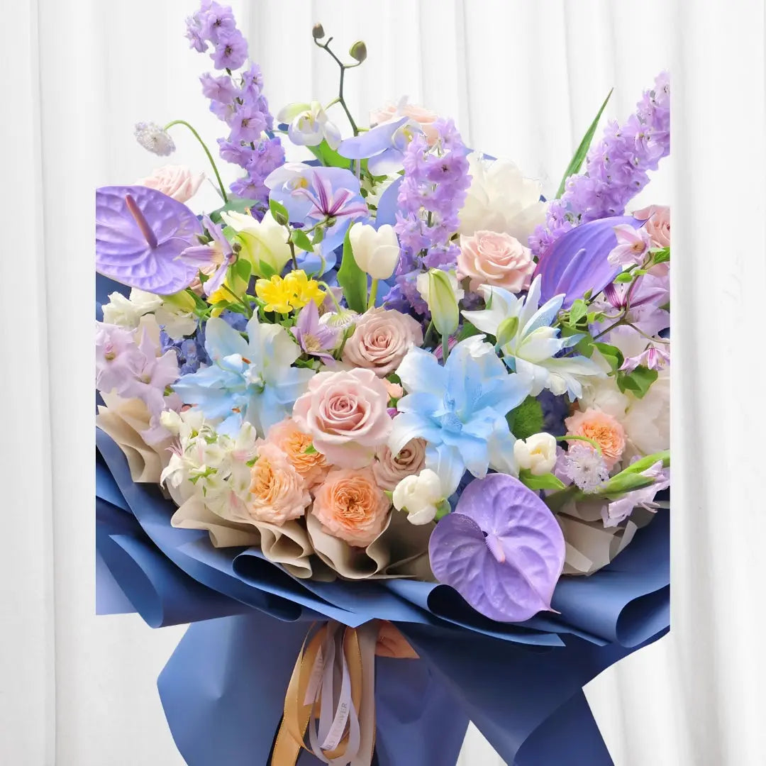 Vibrant mixed floral bouquet with pink roses, delphinium, lilies, orchids, and anthuriums in Hong Kong