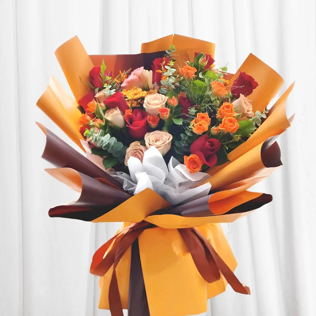 Vibrant red, orange, and peach roses bouquet with yellow marigolds and eucalyptus in Hong Kong
