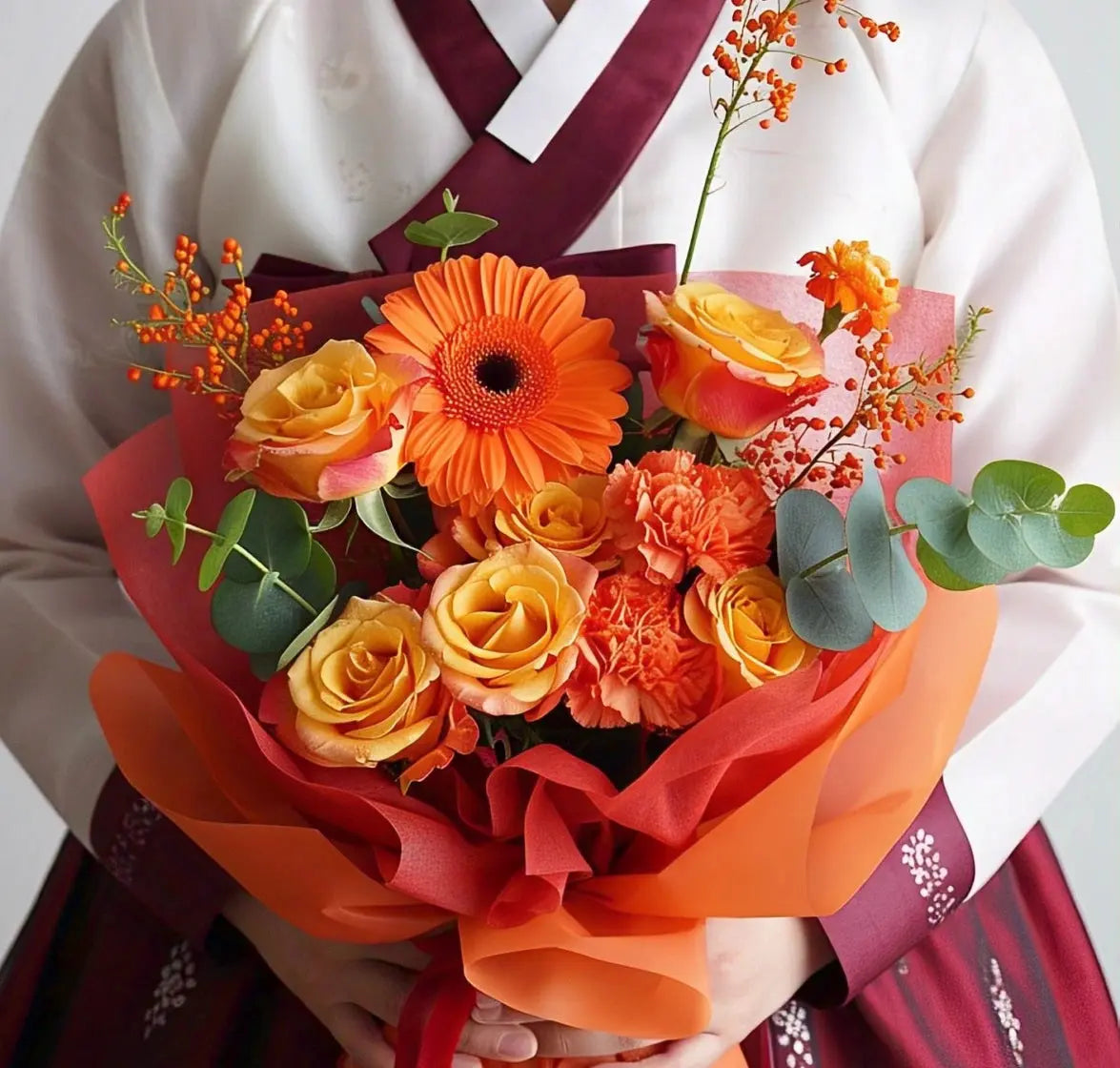 Vibrant orange flower bouquet featuring roses, gerberas, carnations, and eucalyptus leaves, perfect for flower delivery in Hong Kong